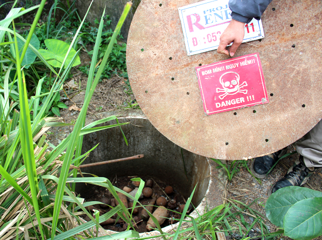 The TBM is a concrete-reinforced and partially buried container with a ventilated lockable lid that is used by scrap dealers to safely quarantine UXO away from children and neighbours.