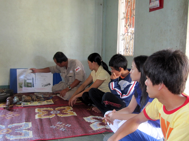 CST Team Leader providing scrap dealers and collectors with basic identification of UXO often found in Quang Tri Province.