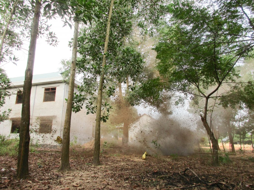 The demolition of the cluster bomb, which is unsafe to remove, is captured by the team's camera.